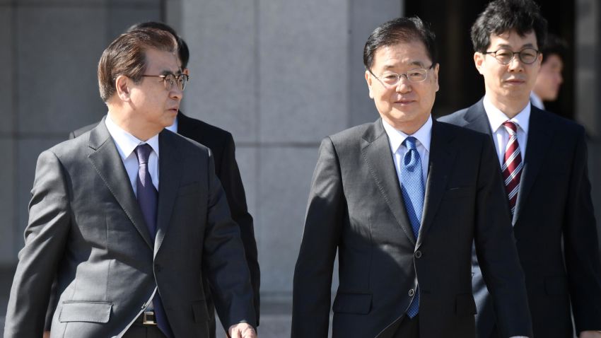 Chung Eui-yong (2nd R), head of the presidential National Security Office, and Suh Hoon (L), the chief of the South's National Intelligence Service, talk before boarding an aircraft as they leave for Pyongyang at a military airport in Seongnam, south of Seoul, on March 5, 2018. 
A South Korean delegation heading to Pyongyang on March 5 will push for talks between the nuclear-armed North and the United States, the group's leader said. / AFP PHOTO / pool / Jung Yeon-je        (Photo credit should read JUNG YEON-JE/AFP/Getty Images)