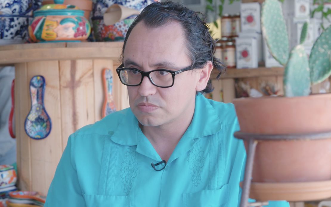 Gustavo Arellano sitting at the 4th Street Market in Santa Ana.