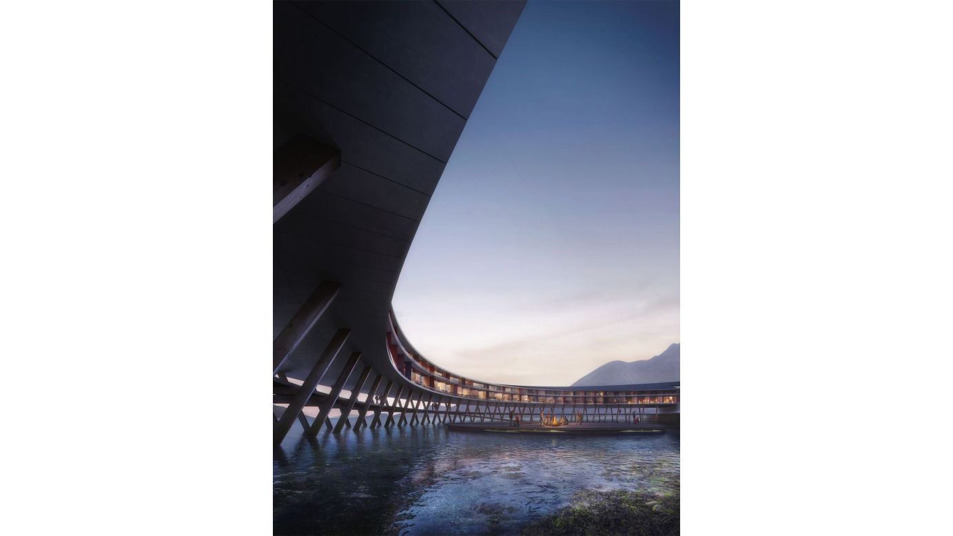 The hotel design resembles a wooden UFO, hovering over the water. Its circular shape means every room will have a unique view of the stunning Arctic scenery.