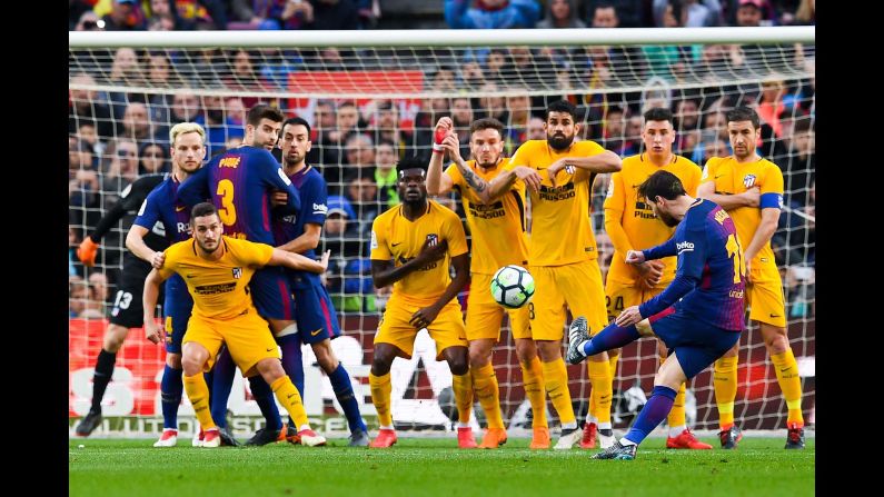 Barcelona star Lionel Messi curves a free kick around a wall to score the only goal in a Spanish league match against Atletico Madrid on Sunday, March 4. It was <a href="index.php?page=&url=http%3A%2F%2Fbleacherreport.com%2Farticles%2F2762594-lionel-messis-600th-goal-lifts-barcelona-to-1-0-la-liga-win-vs-atletico-madrid" target="_blank" target="_blank">Messi's 600th goal</a> for club and country.