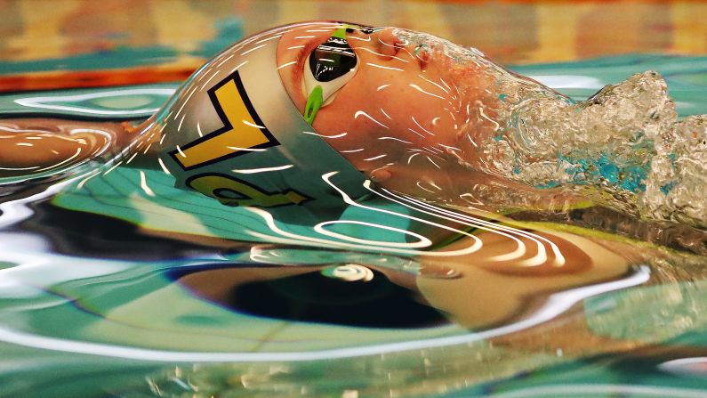 Honey Osrin swims the backstroke during a meet in Edinburgh, Scotland, on Thursday, March 1.