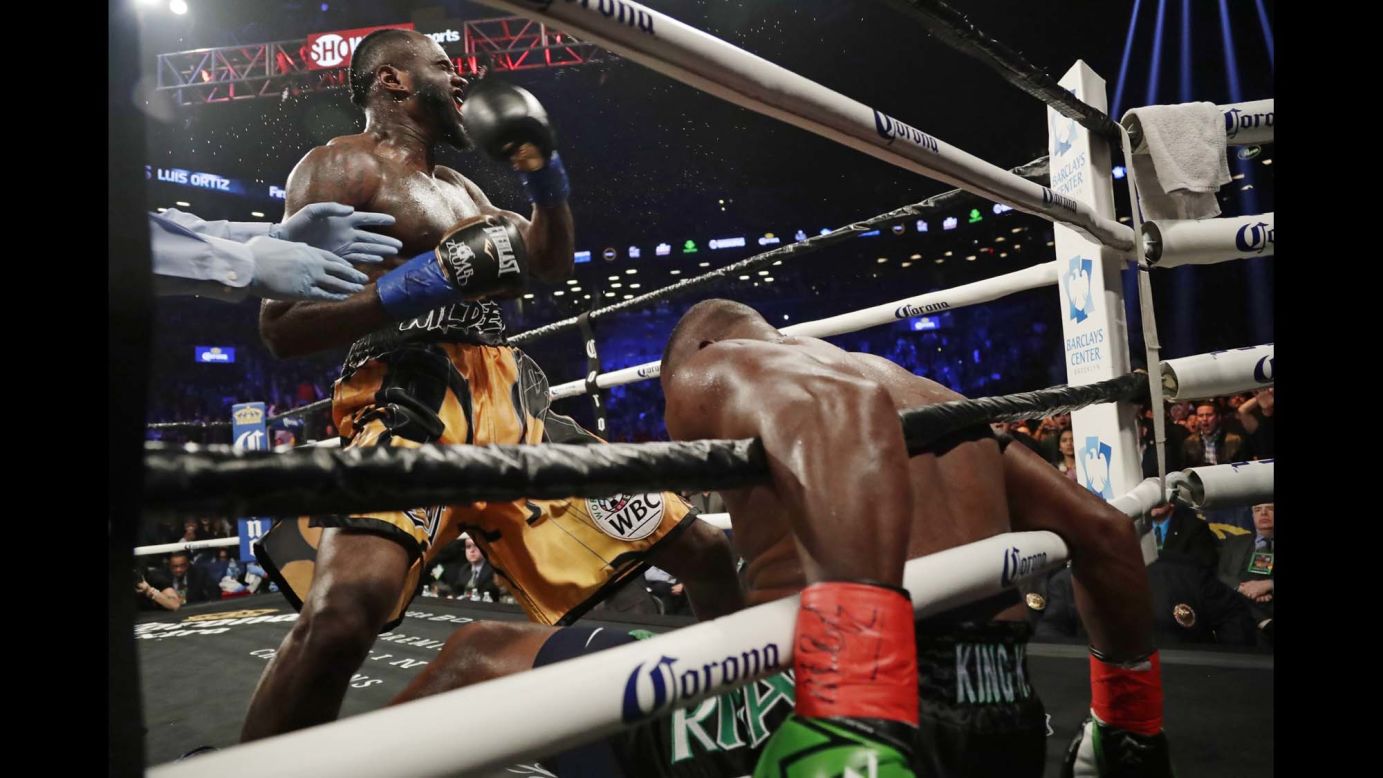 Deontay Wilder celebrates after knocking down Luis Ortiz during the sixth round of their heavyweight title bout on Saturday, March 3. Ortiz got up, but Wilder stopped him in the 10th round to retain his WBC title.