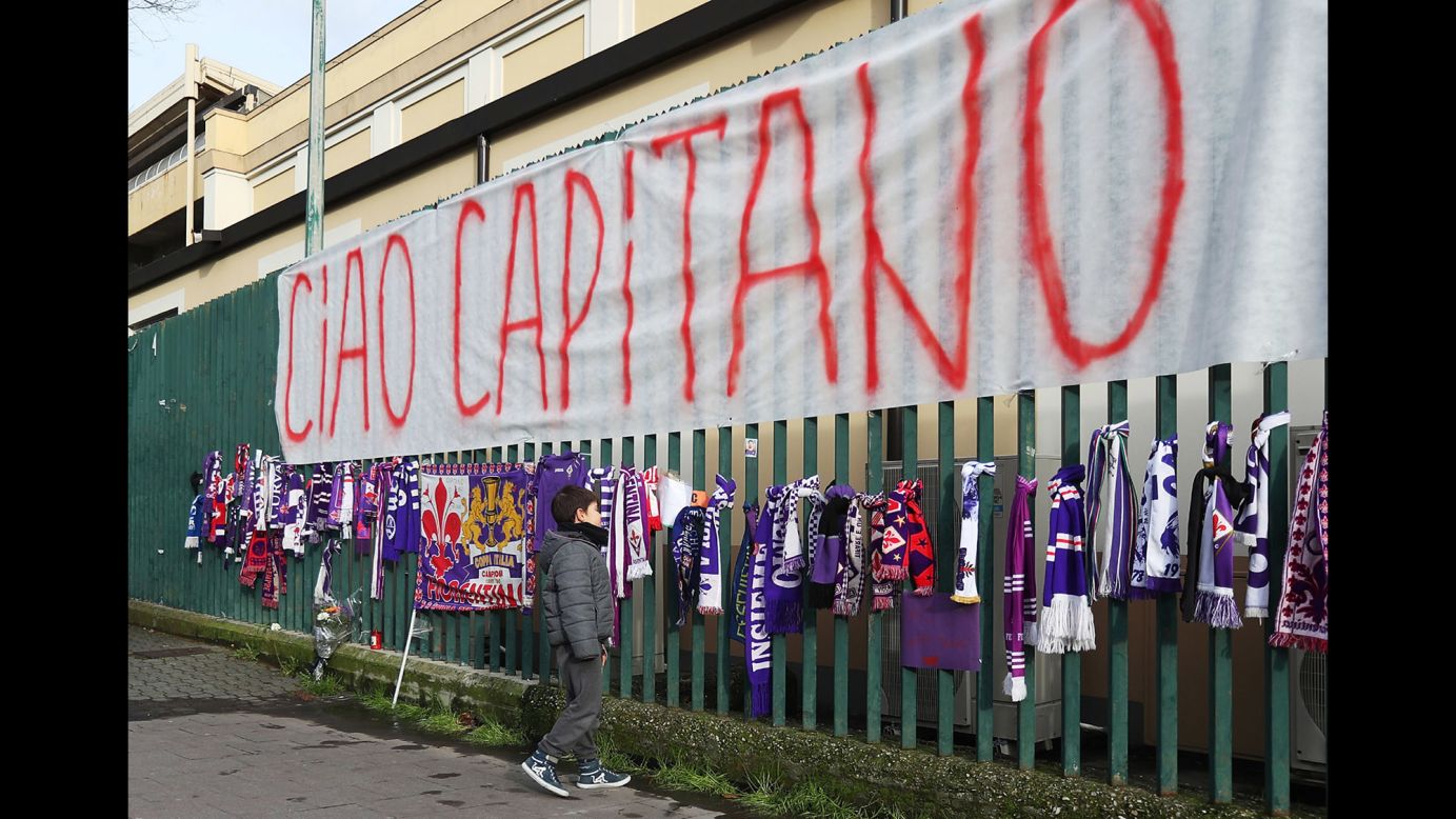 A young fan visits a memorial for Davide Astori outside a soccer stadium in Florence, Italy, on Sunday, March 4. Astori, the 31-year-old captain of Fiorentina,<a href="https://www.cnn.com/2018/03/04/football/italian-footballer-fiorentina-davide-astori-dies/index.html" target="_blank"> was found dead</a> on Sunday morning ahead of his team's match against Udinese. The club said he died of a sudden illness.