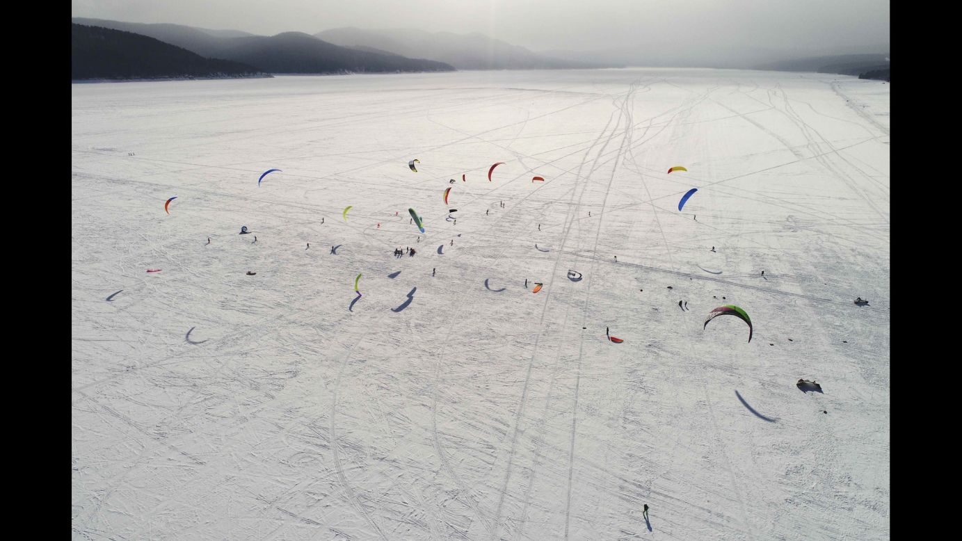 Kite boarders and kite skiers compete on the ice-covered Yenisei River outside Krasnoyarsk, Russia, on Sunday, March 4.