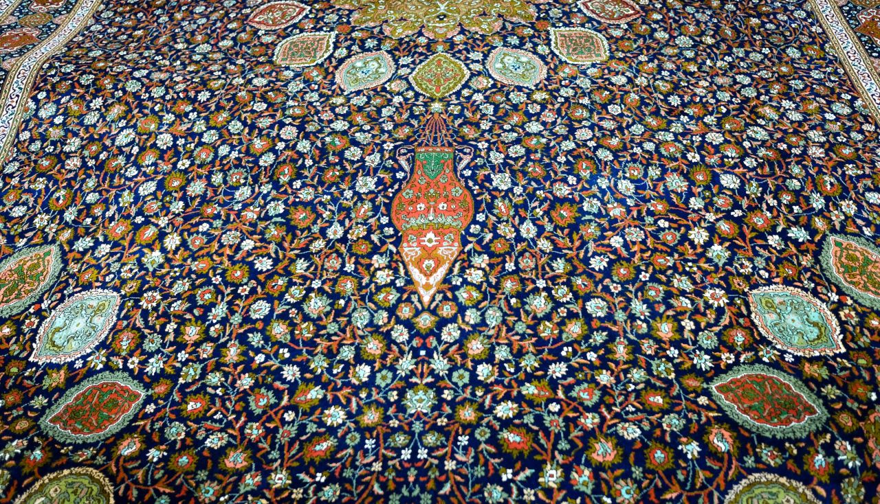 <strong>Ardabil Carpet: </strong>Made in the 1960s by Bhat's family, this shimmering blue carpet is a silk redesign of a famous Persian wool creation from 1540 known as "<a href="https://www.vam.ac.uk/articles/the-ardabil-carpet?gclid=Cj0KCQiAuP7UBRDiARIsAFpxiRKGnNtgKMWPzhvZIz_djKGosINHe-4ah2qYiTuyhpZ09KASUEUaIh0aAgCYEALw_wcB" target="_blank" target="_blank">The Ardabil Carpet</a>" that's on display in London's V&A museum. Bhat says the reproduction took four years to complete and contains 9,525,600 knots. It's estimated cost is *8,500.