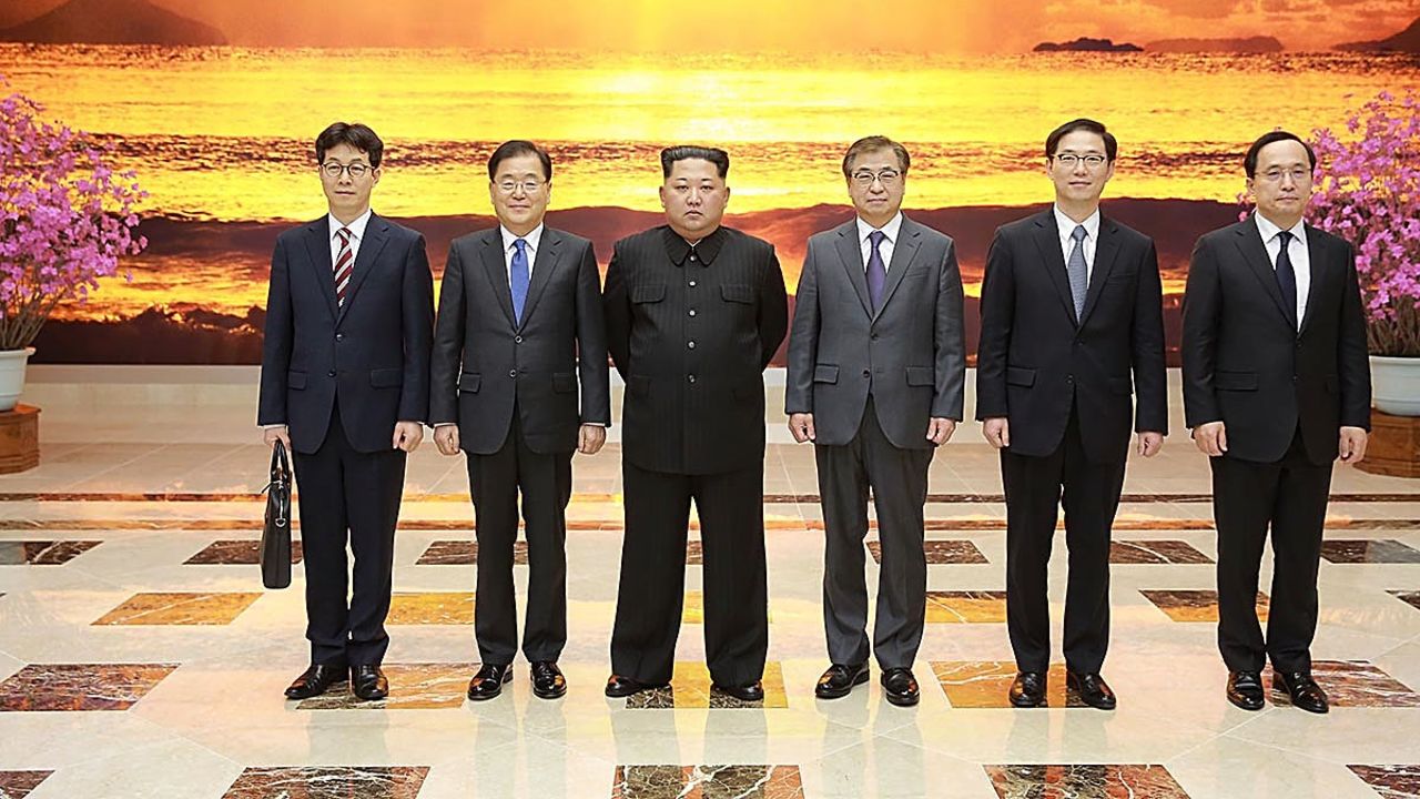 In this handout image provided by the South Korean Presidential Blue House, Chung Eui-yong (second from the left), head of the presidential National Security Office pose with North Korean leader Kim Jong Un (third from the left) on Monday in Pyongyang, North Korea.