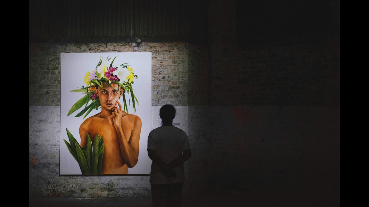 This portrait is by Mauritian artist, Thierry Amery. The crown of flowers ties in with the festival's theme, representing man's relationship with nature. 