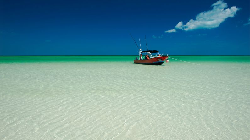 <strong>No, that's not Photoshopped:</strong> Bright blue-green waters surround the island, and it's usually warm enough to swim.