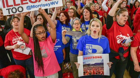 Teachers hold a rally Monday outside Senate chambers in the West Virginia state Capitol.