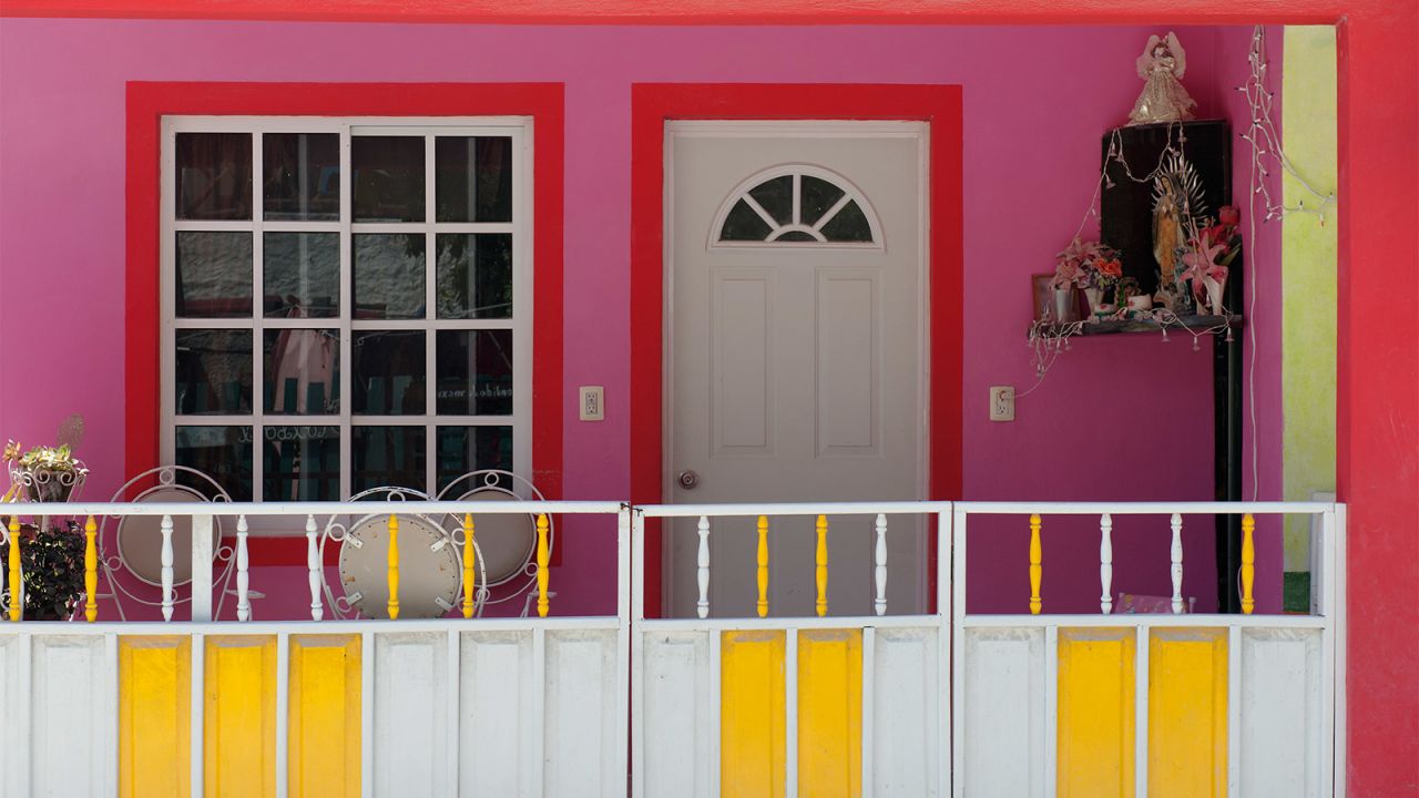 <strong>Bright colors and bold patterns:</strong> Holbox (pronounced Hole-bosh) has about 2,000 full-time residents, many of whom live in brightly painted homes like this one.