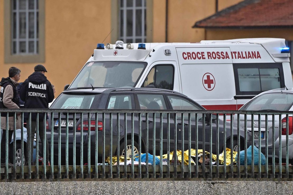 Police and rescuers at the site of the shooting in Florence on Monday.