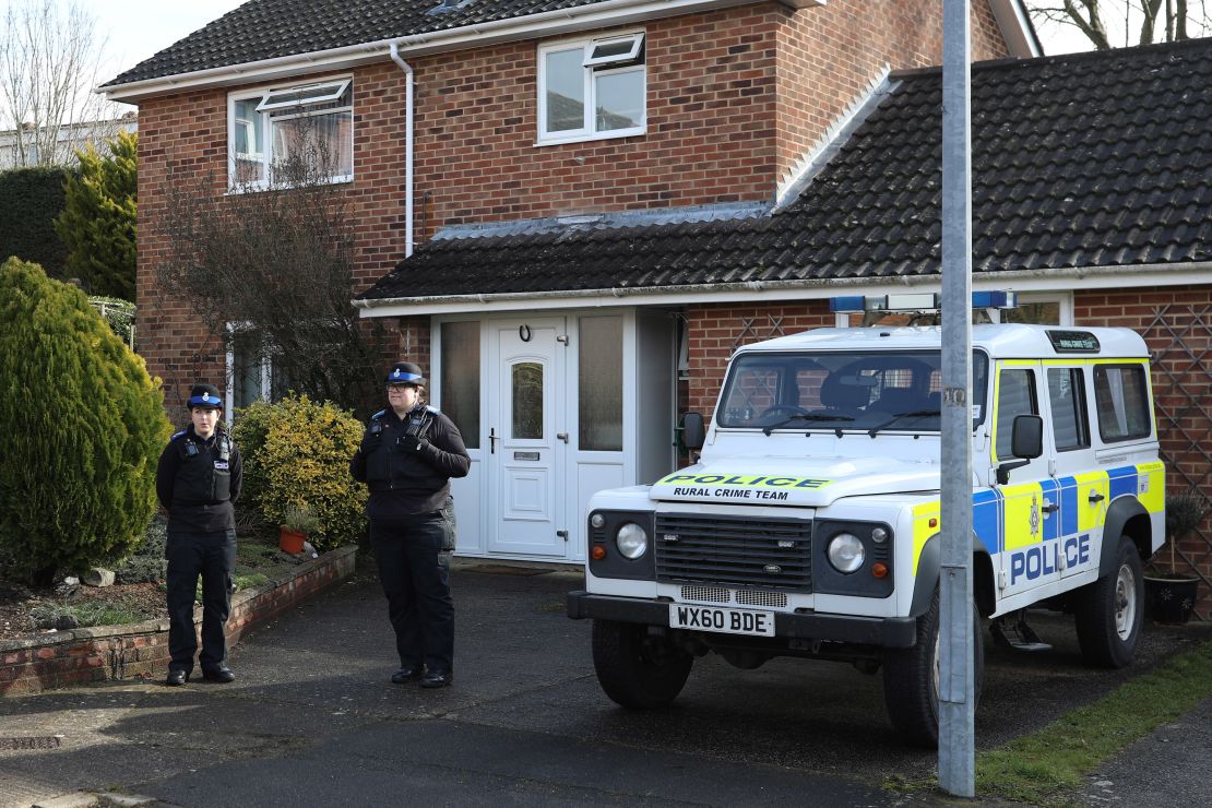 Police officers stand outside the home of  Sergei Skripal after a man and woman were found unconscious in Salisbury town centre two days previously, on March 6, 2018 in Salisbury, England. 