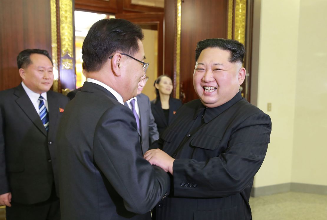 North Korean leader Kim Jong Un (right) shaking hands with South Korean national security chief Chung Eui-yong. In between them is Kim's sister, Kim Yo Jong.