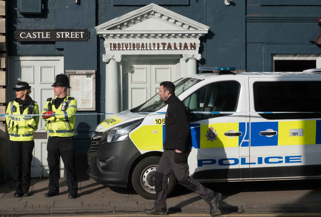 Police officers outside the Zizzi restaurant in Salisbury which has been closed following the incident.