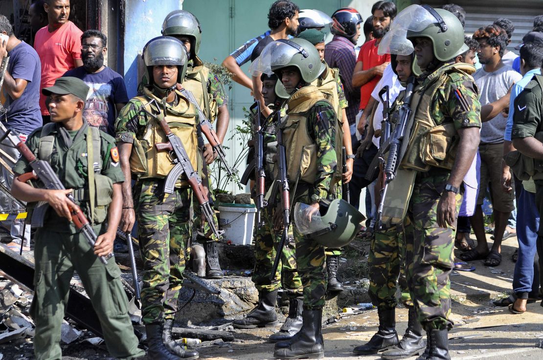 Sri Lankan police commandos patrol the streets of Pallekele, a suburb of Kandy, on March 6, 2018.
