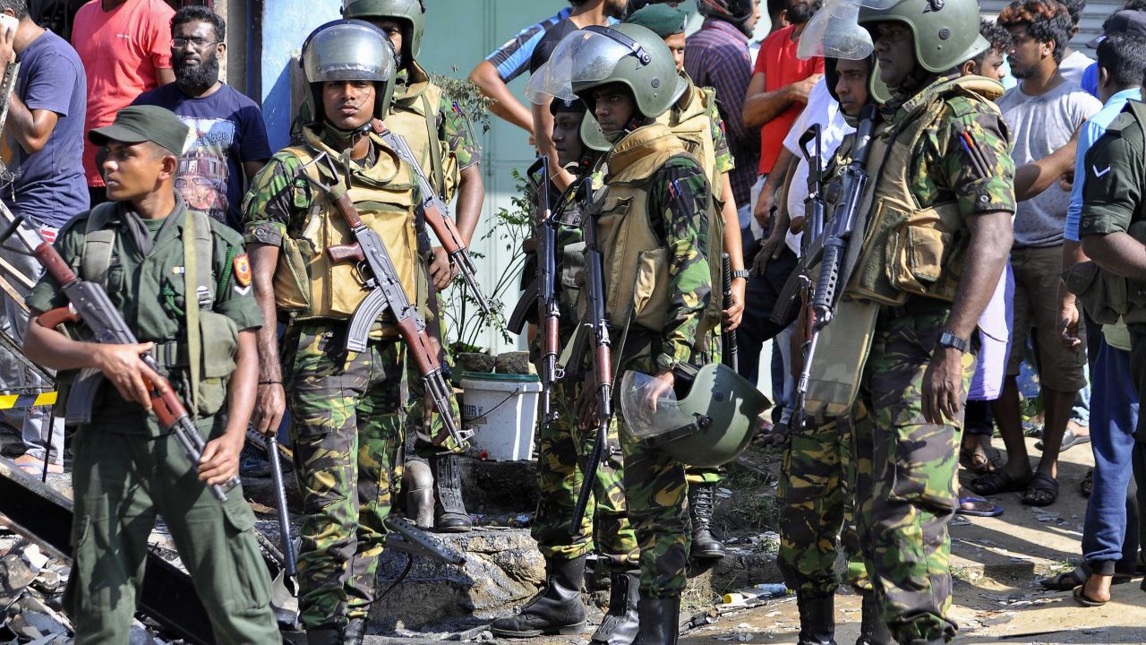 Sri Lankan police commandos patrol the streets of Pallekele, a suburb of Kandy, on March 6, 2018.