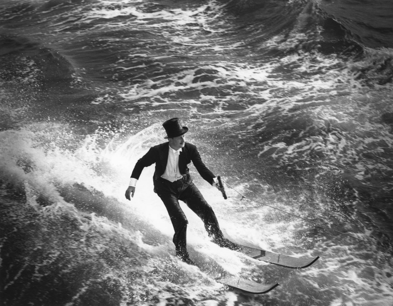 Named "The dashing, splashing father of water skiing" by <a href="https://www.si.com/vault/1987/08/10/115909/the-dashing-splashing-father-of-waterskiing" target="_blank">Sports Illustrated</a>, an 18-year-old Ralph Samuelson "unwittingly" invented water skiing on Lake Pepin, Minnesota, in 1922 (not pictured). Already partial to riding a board off the back of his brother's powerboat, Samuelson also partook in winter sports. He tried snow skis on the lake and promptly sank. He tried other modifications to no avail until he increased the skis' surface area, using two 8-foot by 9-inch pine planks. He added leather foot straps, held on to an iron ring tied to a 100-foot tow rope and, after trying a few starting positions, he was off.