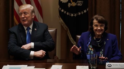 President Donald Trump and Democratic Sen. Dianne Feinstein of California share a moment during a meeting with bipartisan members of the Congress at the Cabinet Room of the White House on February 28, 2018 in Washington, DC.