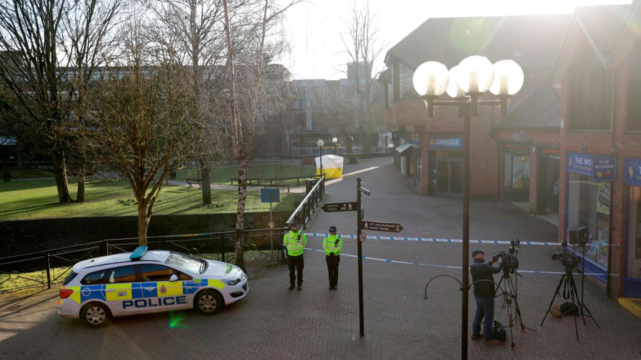 Police officers guard a cordon around a police tent covering the the spot where former Russian double agent Sergei Skripal and his daughter were found critically ill Sunday following exposure to an "unknown substance" in Salisbury, England, Wednesday, March 7, 2018. Britain's counterterrorism police took over an investigation Tuesday into the mysterious collapse of the former spy and his daughter, now fighting for their lives. The government pledged a "robust" response if suspicions of Russian state involvement are proven. Sergei Skripal and his daughter are in a critical condition after collapsing in the English city of Salisbury on Sunday. (AP Photo/Matt Dunham)