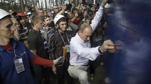 Putin scales a climbing wall at a summer camp run by the political Nashi youth group at Lake Seliger in northern Russia.