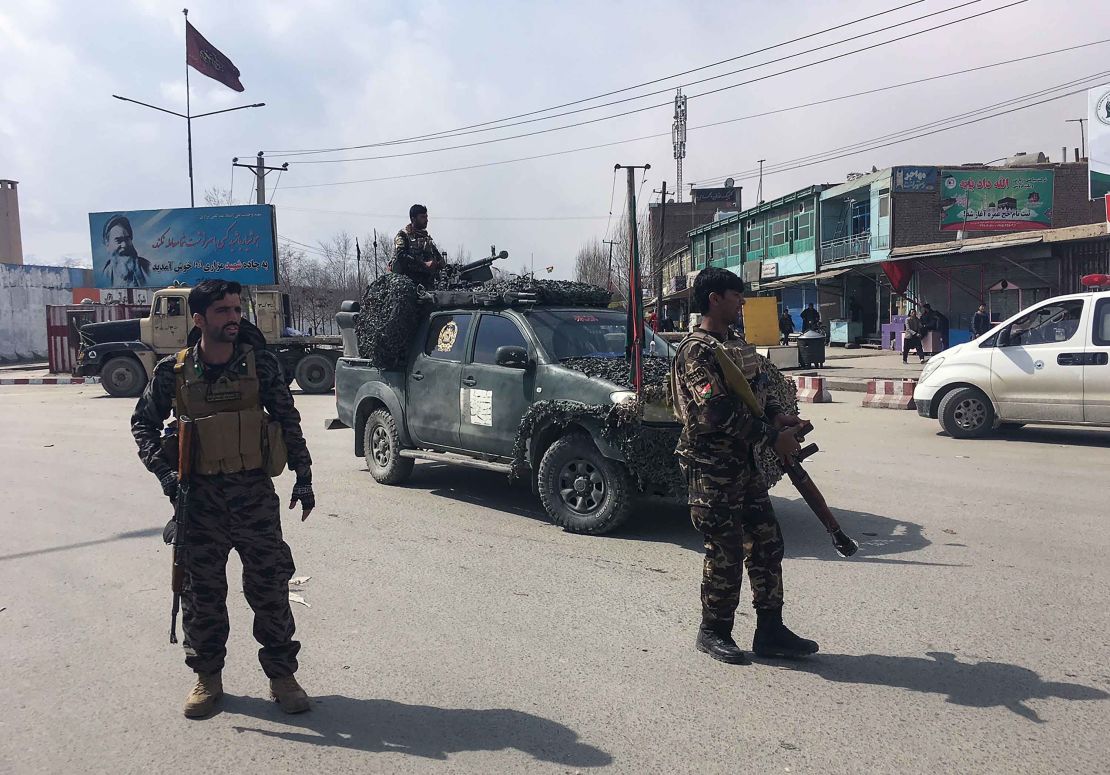 Afghan security forces keep watch near the site of an explosion in Kabul on March 9.