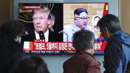 People watch a TV screen showing North Korean leader Kim Jong Un and U.S. President Donald Trump, left, at the Seoul Railway Station in Seoul, South Korea, Friday, March 9, 2018. Trump has accepted an offer of a summit from the North Korean leader and will meet with Kim Jong Un by May, a top South Korean official said Thursday, in a remarkable turnaround in relations between two historic adversaries. The signs read: " Trump has accepted an offer of a summit from the North Korean leader and will meet with Kim by May." (AP Photo/Ahn Young-joon)