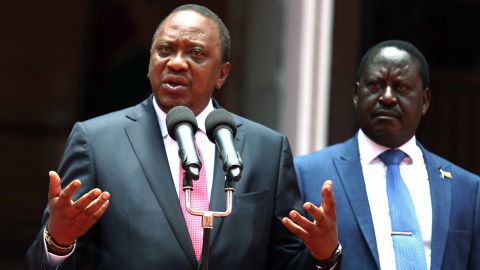 Kenyan President Uhuru Kenyatta, left, and rival Raila Odinga vow to work together on Friday in Nairobi.