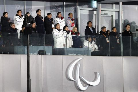 South Korean President Moon Jae-in -- front row, middle -- sings the national anthem at the opening ceremony on Friday.