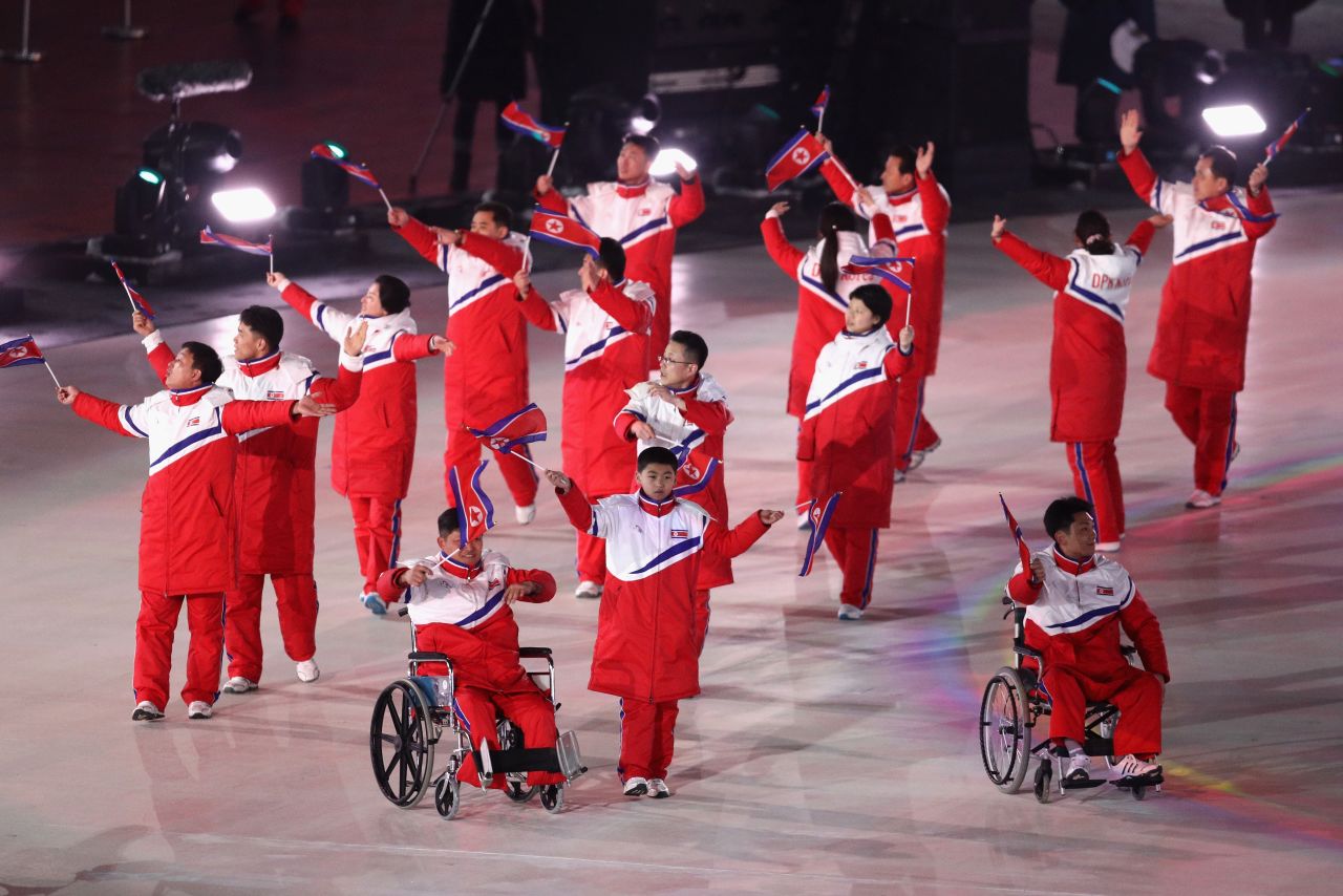 The North Korean delegation follow their two athletes into the arena during the Parade of Nations.