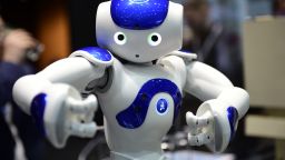 HANOVER, GERMANY - MARCH 20: The robot "Nao" performs Tai Chi at the IBM stand at the CeBIT 2017 Technology Trade Fair on March 20, 2017 in Hanover, Germany. "Nao" has a face detection and can either play football, teach Tai Chi or just entertain. The 2017 CeBIT will run from March 20-24. (Photo by Alexander Koerner/Getty Images)