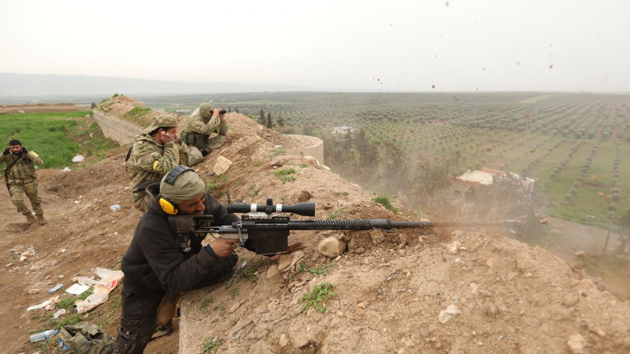 Turkish-backed Syrian rebels fight Kurdish forces last week in Jandairis in Syria's Afrin region.