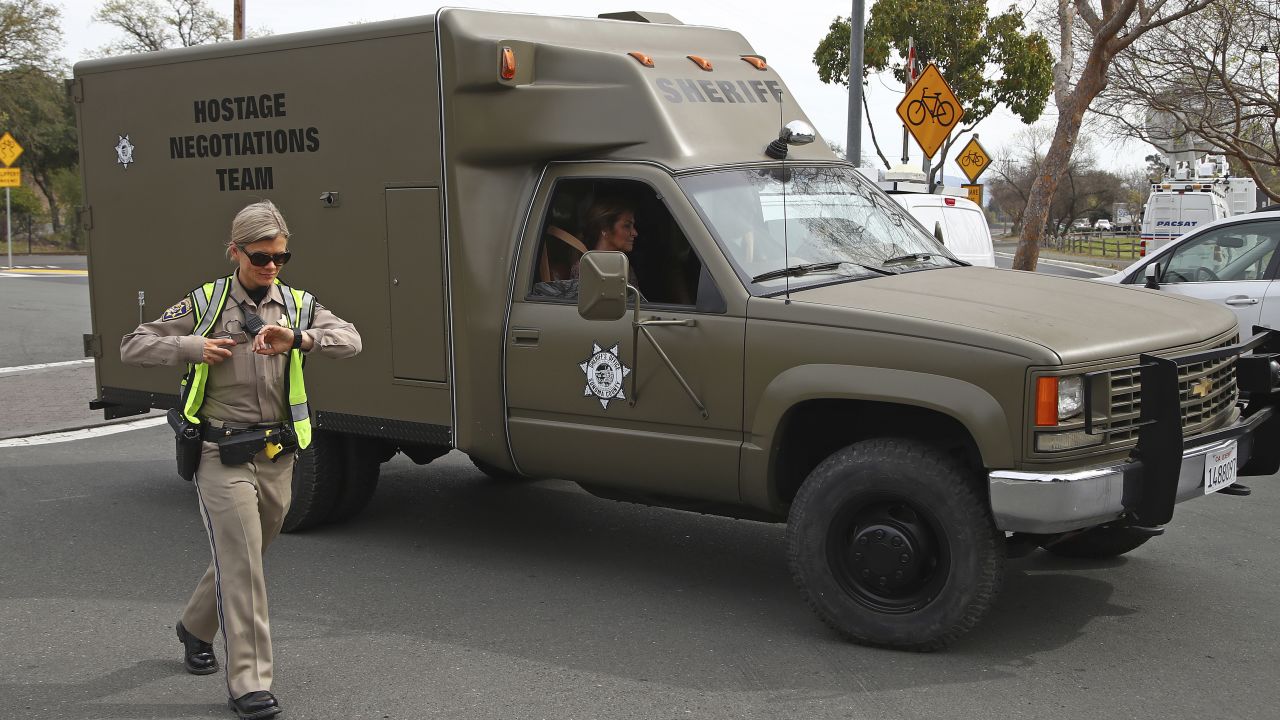 A sheriff's hostage negotiation team passes a California Highway Patrol checkpoint at the Veterans Home of California in Yountville. 