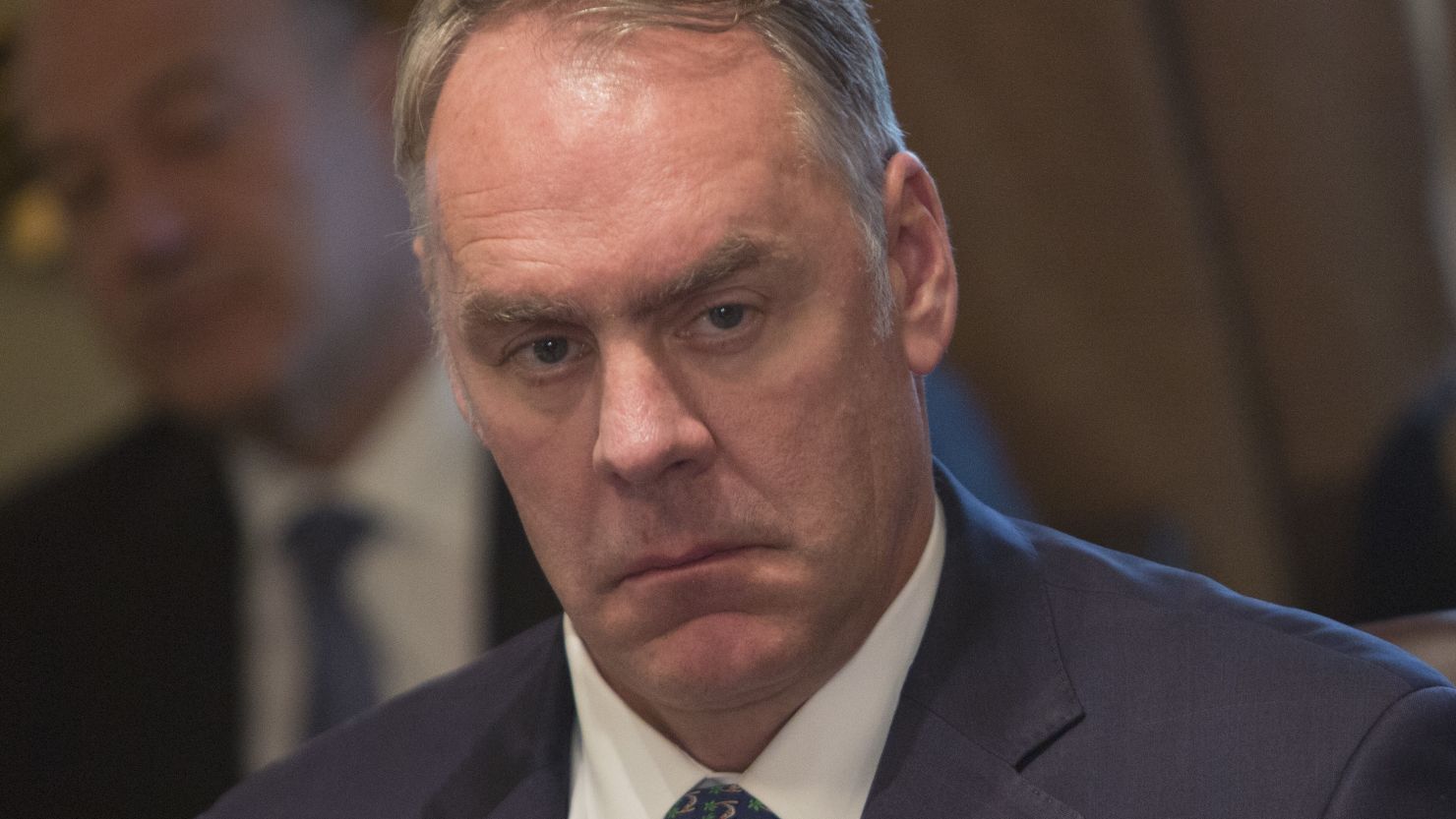 WASHINGTON, DC - DECEMBER 20:  U.S. Secretary of the Interior Ryan Zinke listens during a Cabinet meeting at the White House December  20, 2017 in Washington, DC. President Donald Trump in the meeting extolled passage of the tax reform package as it nears, called for an end to the immigration visa lottery and celebrated the repeal of the Obamacare individual mandate included in the tax package. Trump did not take questons.  (Photo by Chris Kleponis-Pool/Getty Images)