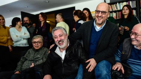Colleagues welcome the release of Sabuncu, second left, and Sık, second right, on Saturday in Istanbul.