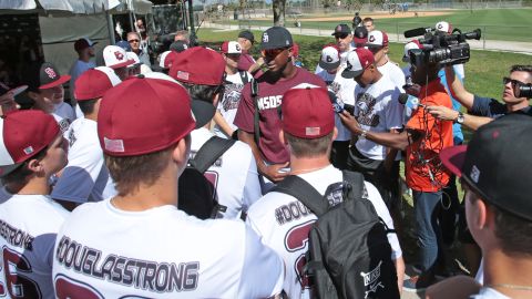Lewis Brinson of the Miami Marlins talks to the Marjory Stoneman Douglas baseball team prior to the spring training game against the St. Louis Cardinals on February 23, 2018.