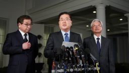 South Korean National Security Advisor Chung Eui-yong (C), flanked by South Korea National Intelligence Service chief Suh Hoon (L) and South Korea's ambassador to the United States Cho Yoon-je (2nd-R), briefs reporters outside the West Wing of the White House on March 8, 2018 in Washington, DC, announcing North Korean leader Kim Jong Un has offered to meet US President Donald Trump. / AFP PHOTO / MANDEL NGAN        (Photo credit should read MANDEL NGAN/AFP/Getty Images)