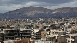 TOPSHOT - A picture taken on February 27, 2018 shows a view of the rebel-held neihgbourhood of Jobar, on the eastern edge of the Syrian capital Damascus following a reported regime bombardment, with Mount Qasioun seen in the background. / AFP PHOTO / Ammar SULEIMAN        (Photo credit should read AMMAR SULEIMAN/AFP/Getty Images)