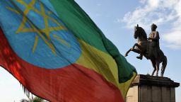 A statue of King II Menelik statue and the Ethiopian Flag in Addis Ababa on March 2, 2017. (Photo by Mohammed Abdu Abdulbaqi/Anadolu Agency/Getty Images)