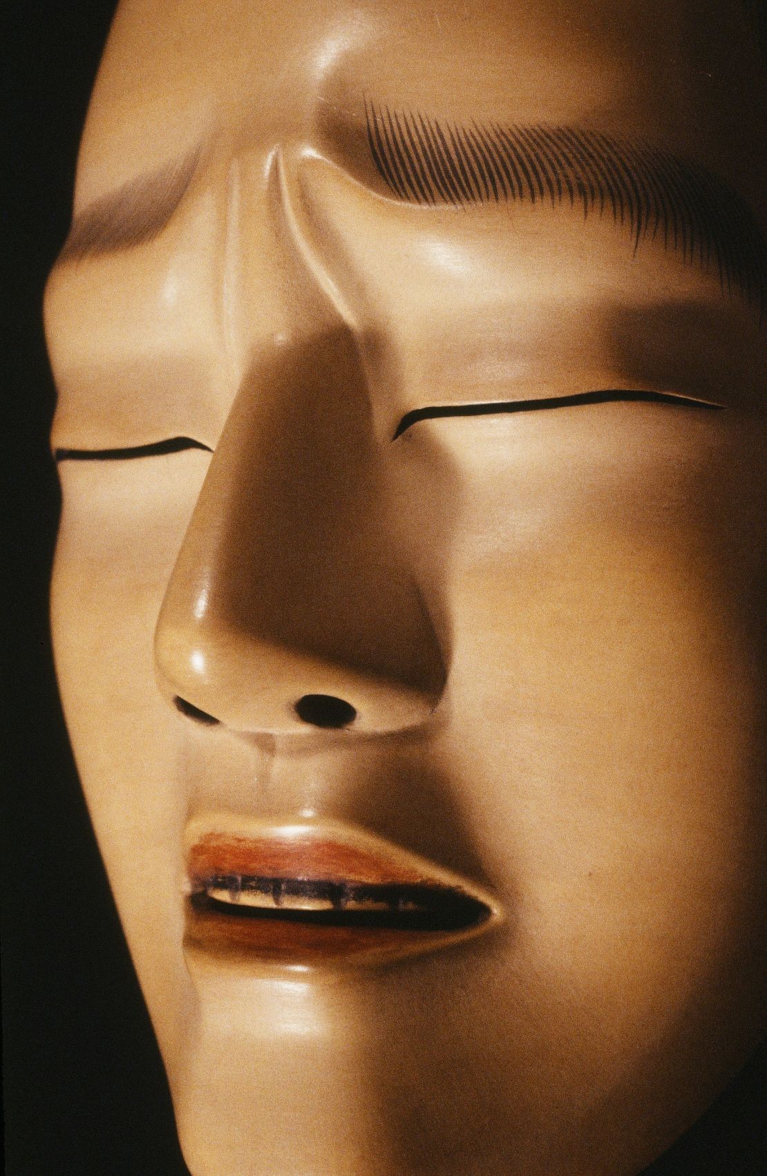 Given the masks' lack of expression, the slightest change in perspective and lighting can bring out a multitude of new emotions.