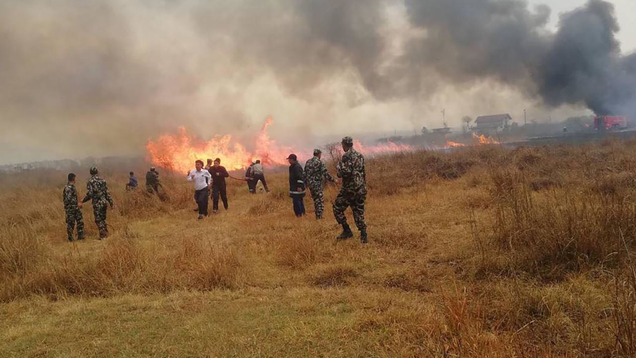 Rescuers at the airport in Kathmandu on Monday.