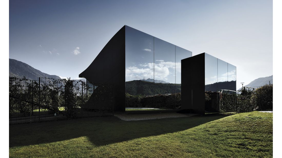 <strong>Mirror Houses, Bolzano, South Tyrol, Italy</strong>: This pair of vacation homes designed by architect Peter Pichler in the southern Dolomite mountains reflect nearby apple orchards and the peaks beyond.