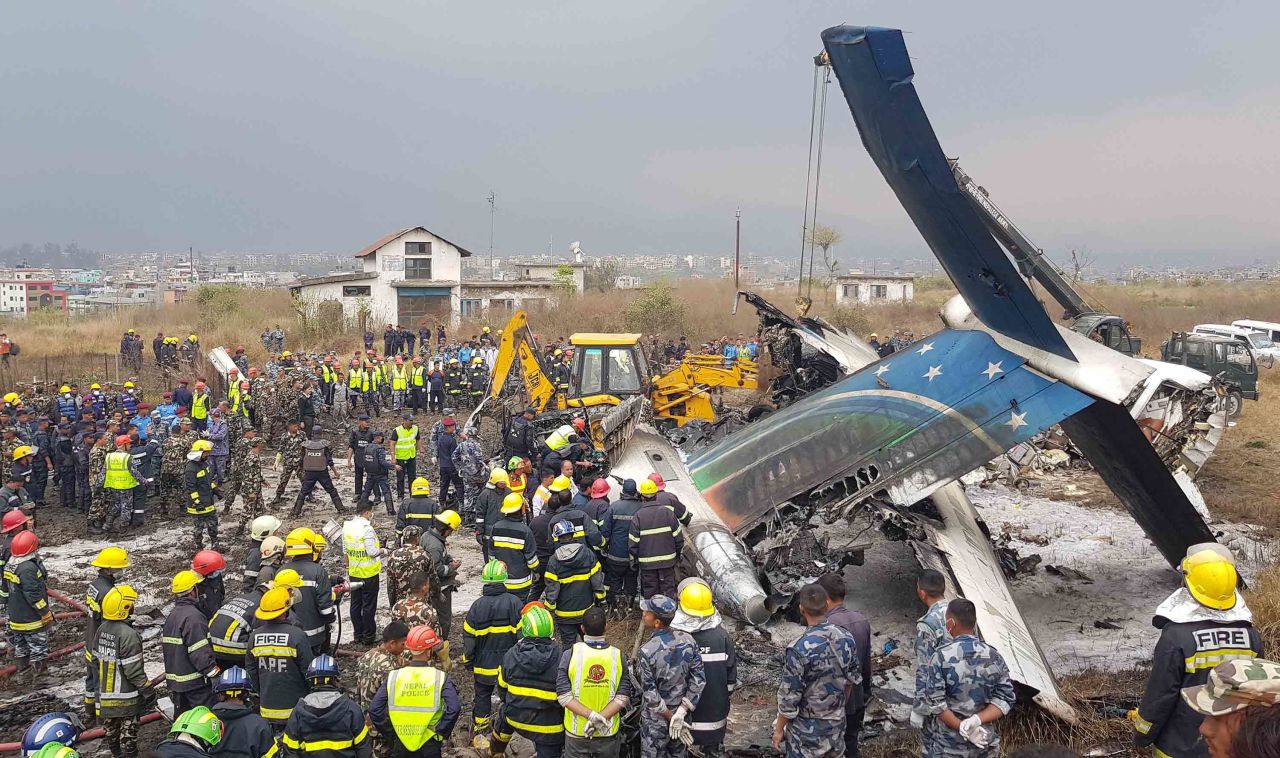 Emergency personnel work around the wreckage of a plane that crashed while landing at the Tribhuvan Airport in Kathmandu, Nepal, on Monday, March 12. Flight BS 211, which was flying in from Dhaka, Bangladesh, <a href="https://www.cnn.com/2018/03/12/asia/kathmandu-plane-crash/index.html" target="_blank">crashed and burst into flames</a> after approaching the runway from the wrong direction, officials said. Dozens were killed.