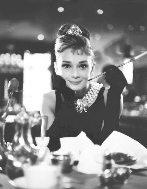 Actress Audrey Hepburn is photographed on the set of the 1961 film "Breakfast at Tiffany's." Hubert de Givenchy, who styled Hepburn's little black dress in the movie, <a href="https://www.cnn.com/style/article/givenchy-dies-intl/index.html" target="_blank">died Saturday</a> at the age of 91.