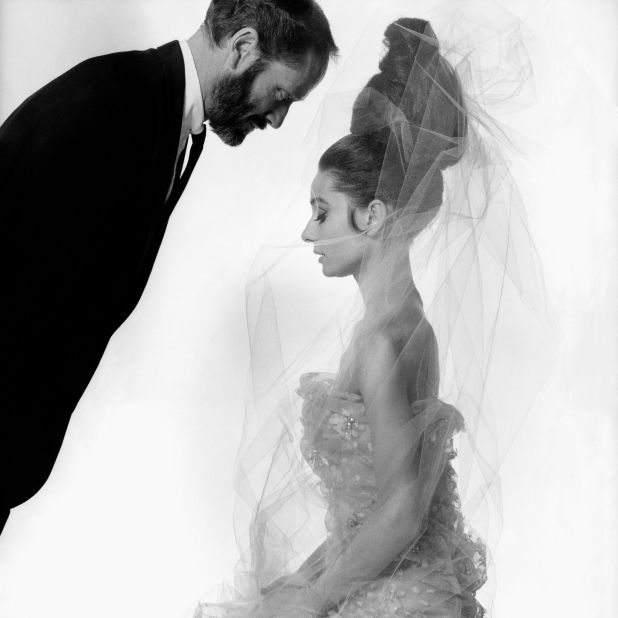 Hepburn -- seen here with her first husband, actor Mel Ferrer -- wears a tulle dress and veil designed by Givenchy.