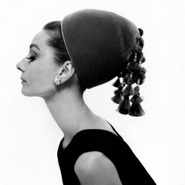 Hepburn wears a Givenchy hat with cut-feather and crystal-bead tassels.