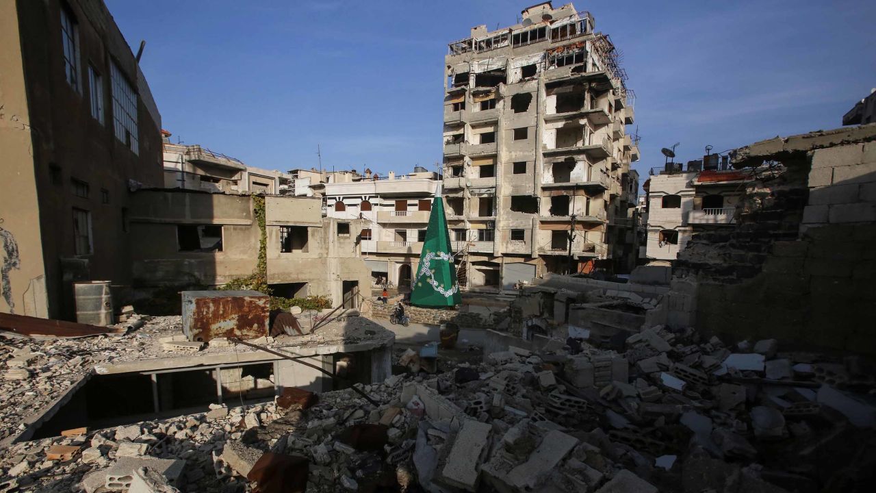 A Christmas tree stands amongst the rubble in the Christian-majority neighbourhood of Hamidiyeh, in the old city of Homs, on December 17, 2017.