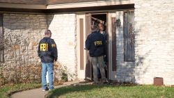 Authorities are investigating the scene in East Austin, Texas, after a teenager was killed and a woman was injured in the second Austin package explosion in the past two weeks Monday, March 12, 2018. Authorities say a package that exploded inside of an Austin home on Monday is believed to be linked to a deadly package sent to another home in Texas' capital city earlier this month. (Ricardo B. Brazziell/Austin American-Statesman via AP)