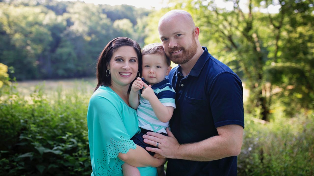 Amber and Elliott Ash with their son Ethan, who was conceived from a frozen embryo.
