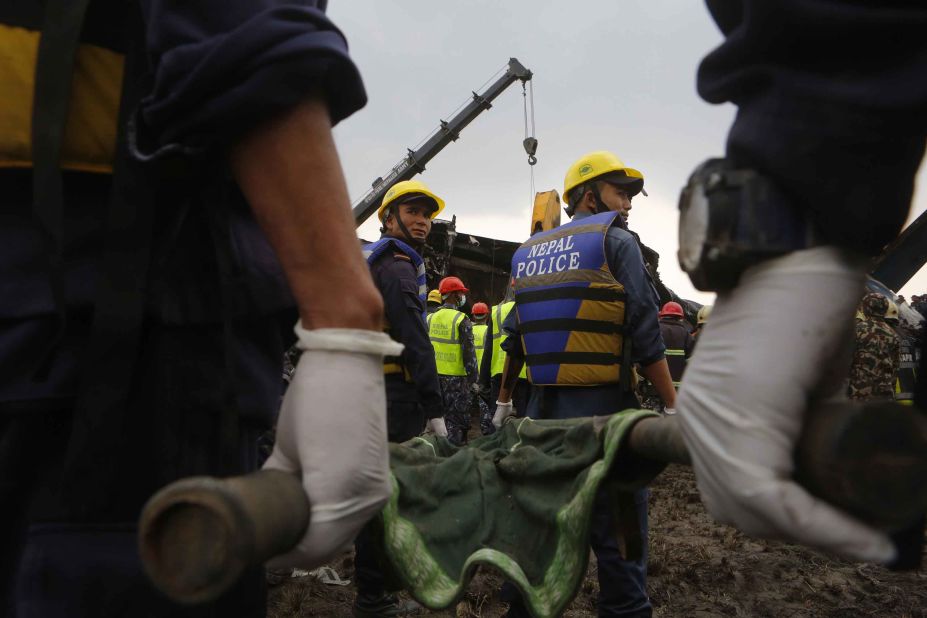 Rescuers work to recover victims on March 12. Officials said 40 bodies were recovered at the scene and nine died at the hospital. Twenty-two survivors were receiving treatment.