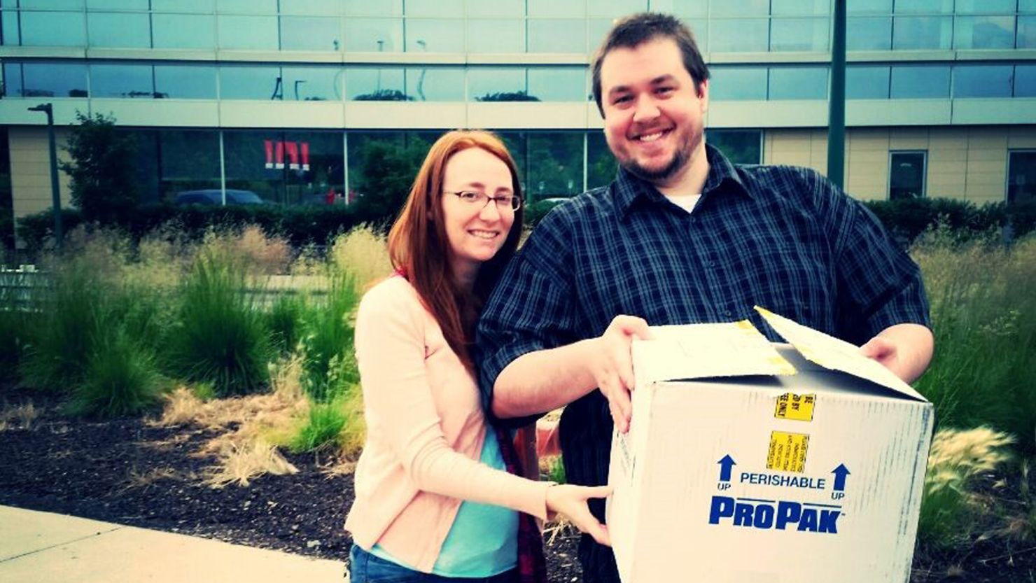 Kate and Jeremy Plants with a box of medications needed for in-vitro fertilization.